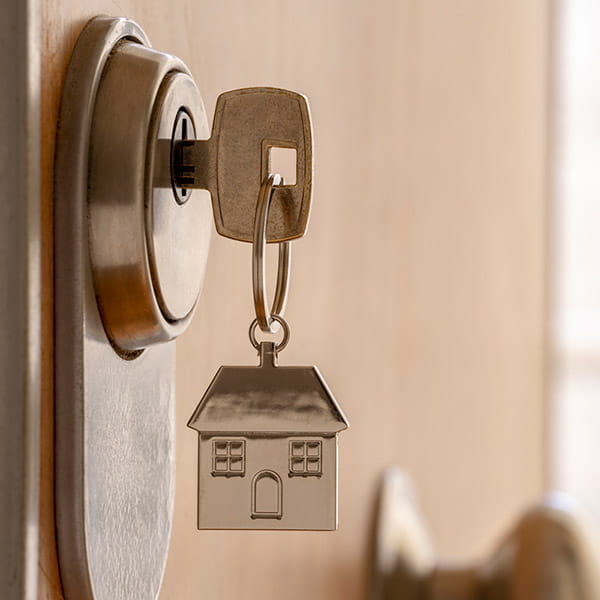 keys in the front door of a home